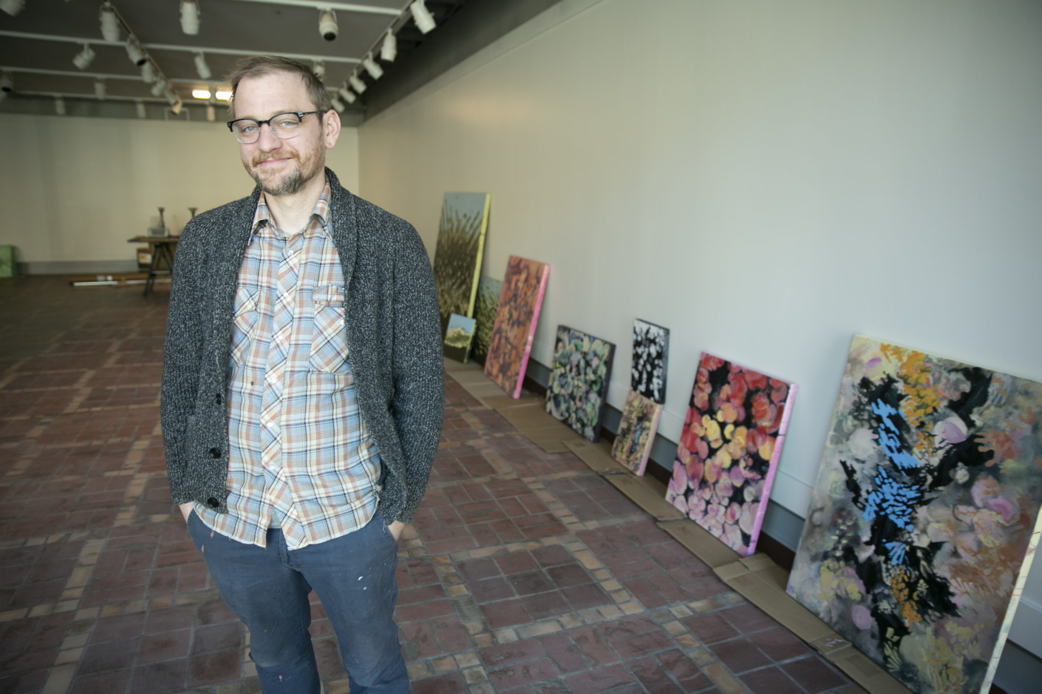 Ben Dunn is pictured in an art gallery