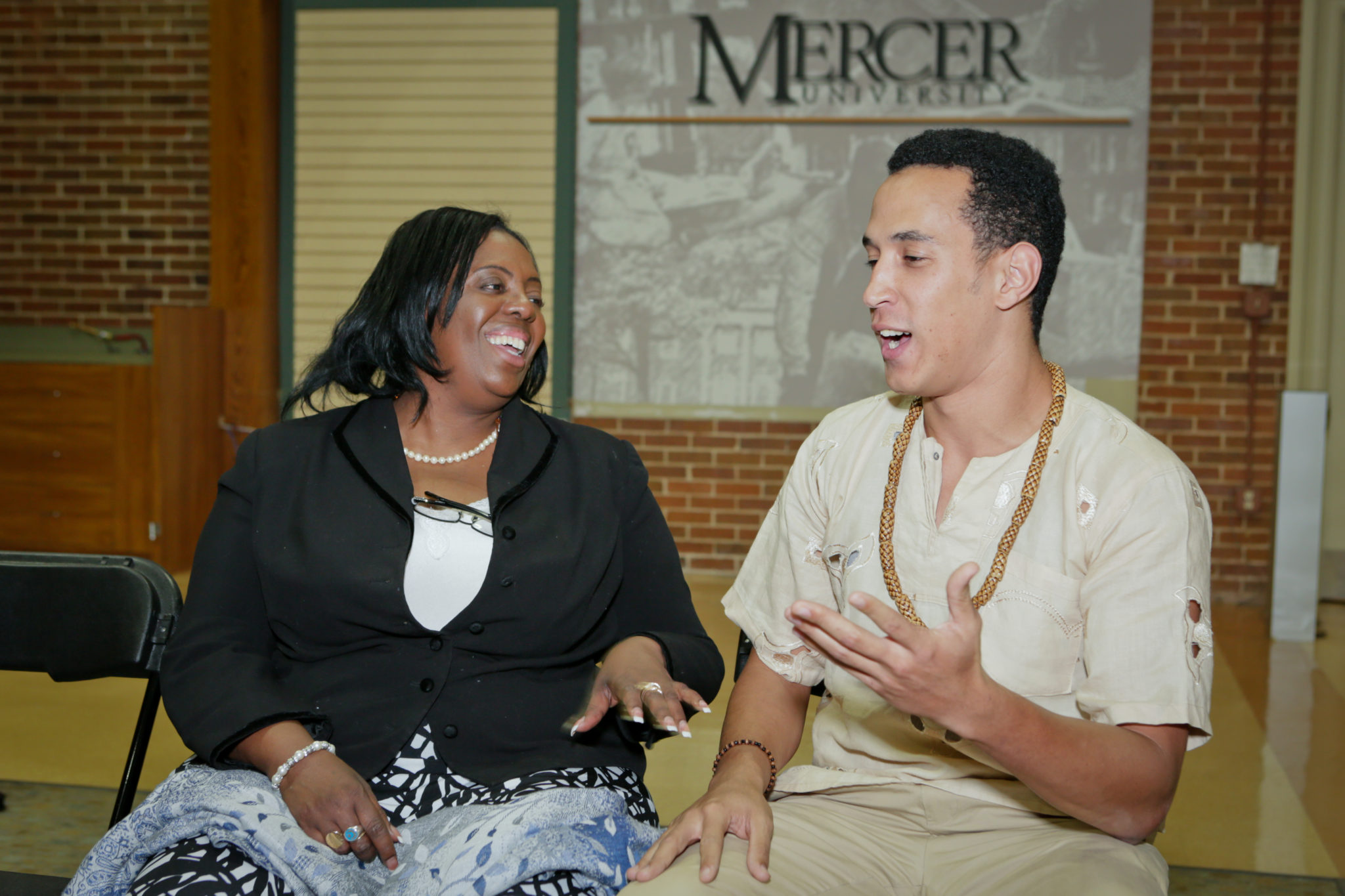 2012 Honorable Amina Salum Ali, African Union Ambassador engages with a student.