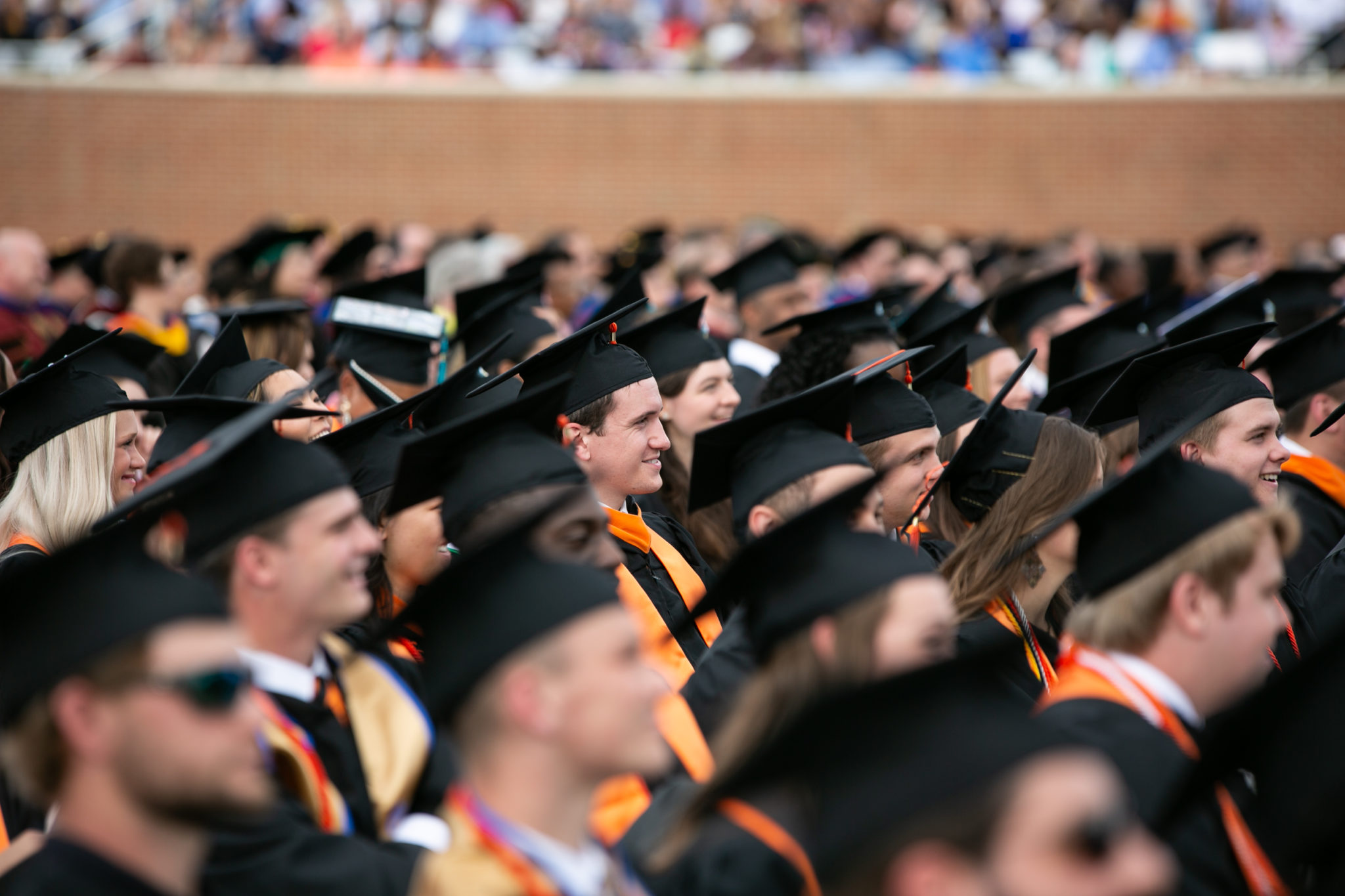 Student seated at 2019 commencement