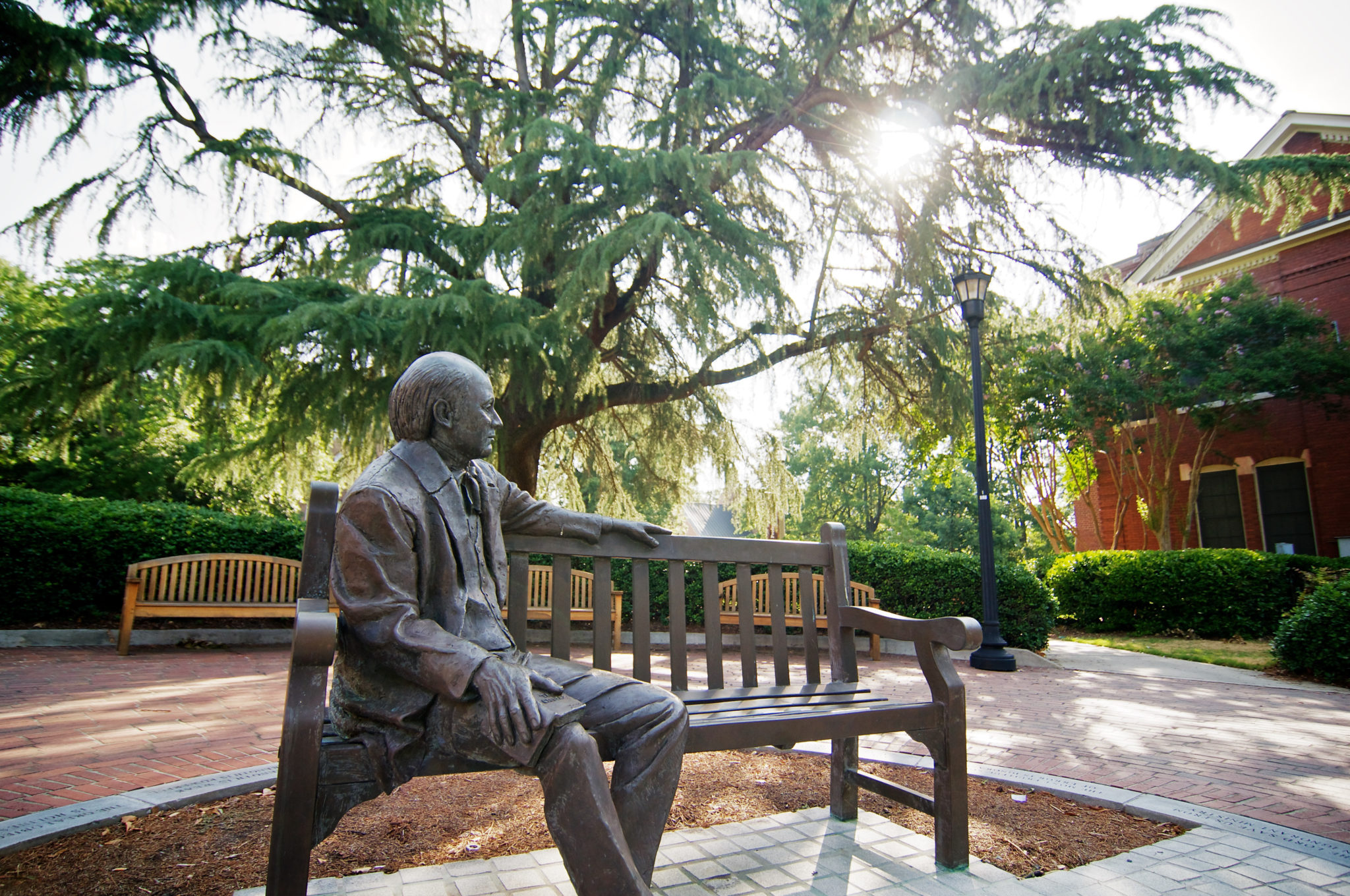 The Jesse Mercer statue is pictured with afternoon sun shining