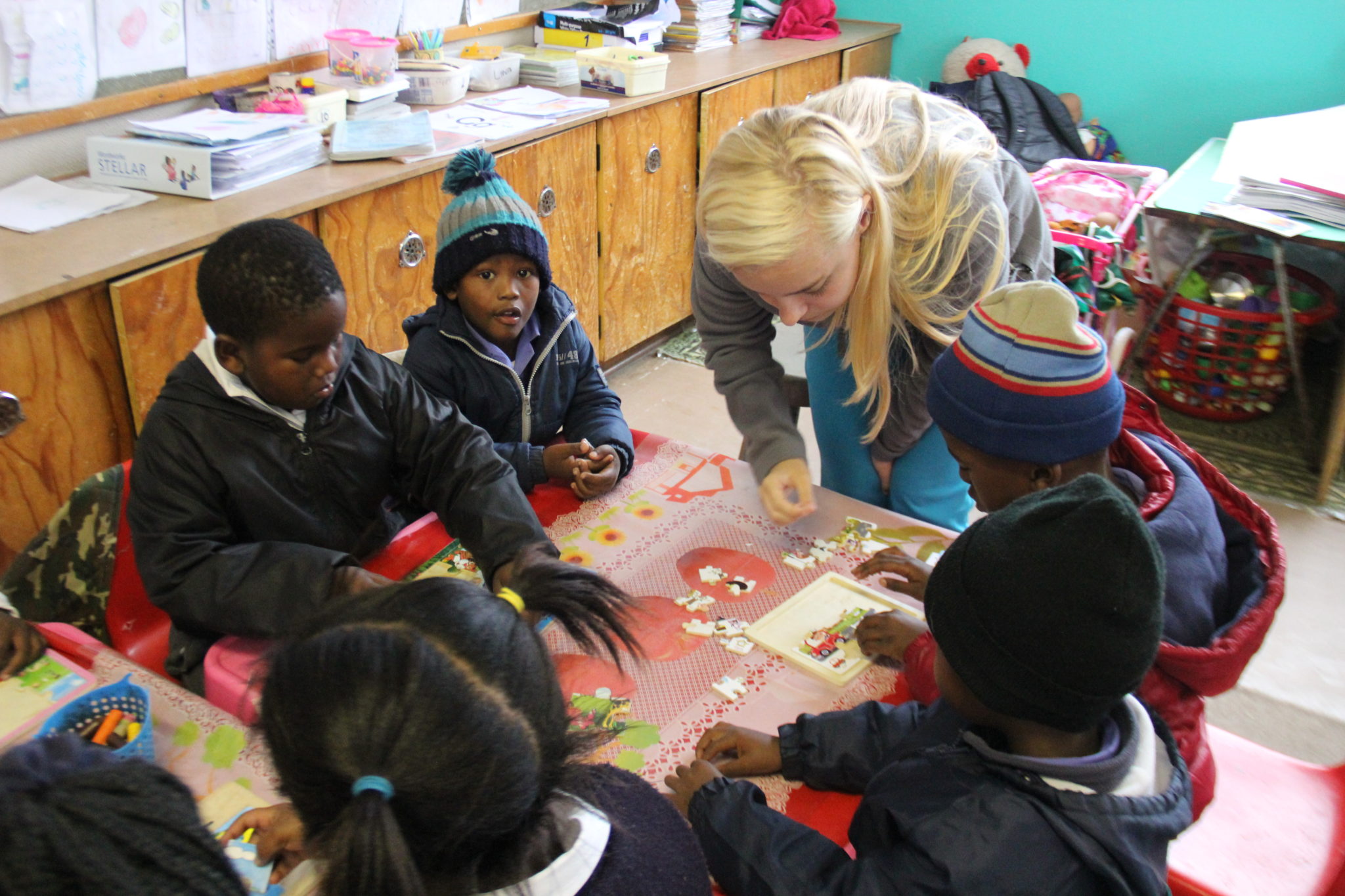 A Mercer student works with children in South Africa.