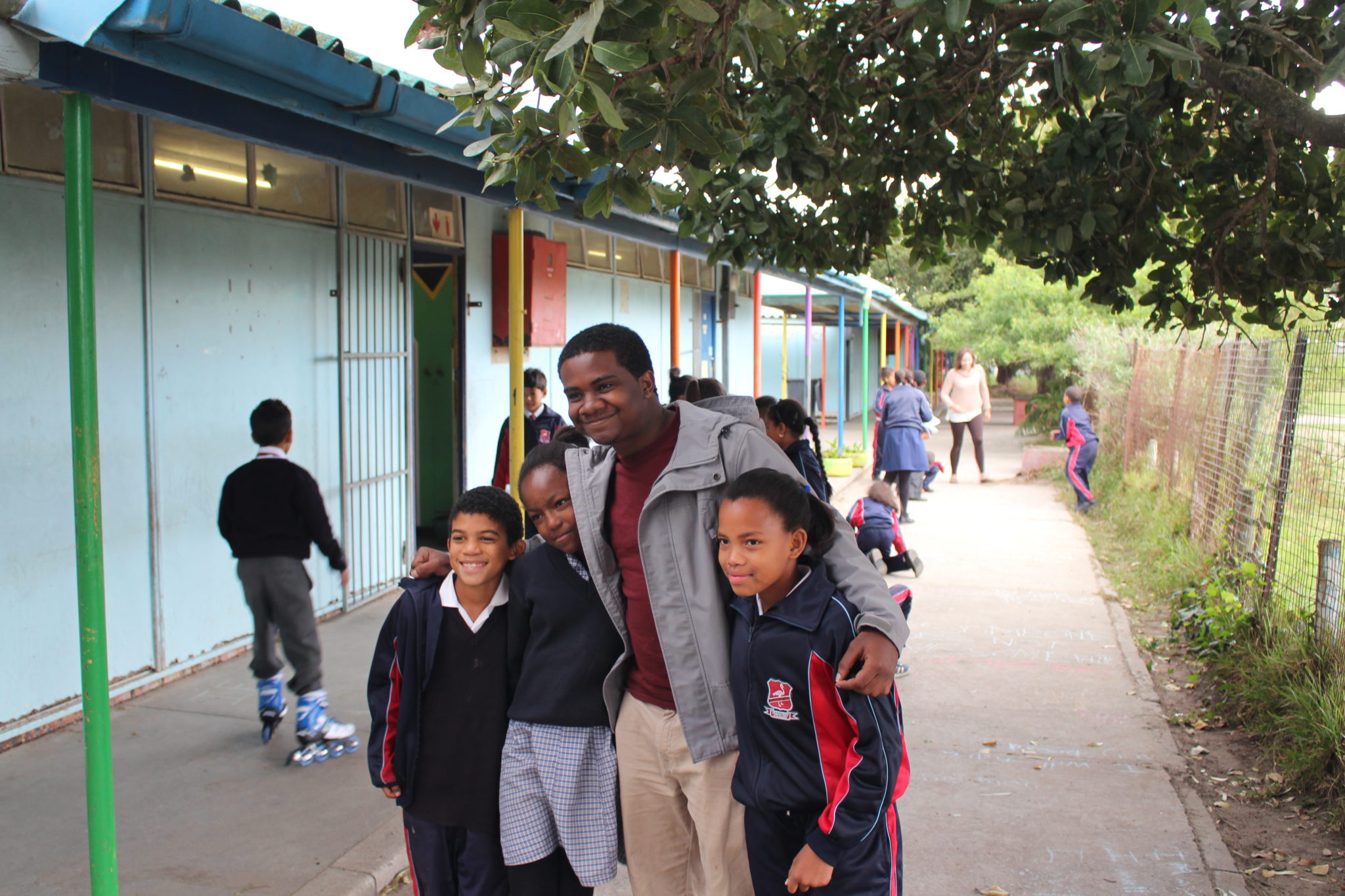 A Mercer student is pictured with two local kids on Mercer On Mission in South Africa.