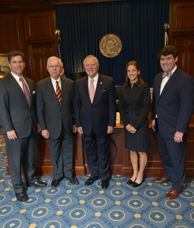Former Georgia Gov. Nathan Deal with others in his office.