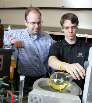 A professor and student work in a Mercer University chemistry lab.