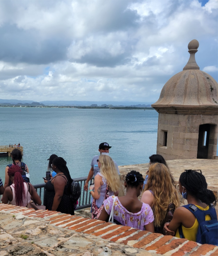 a group of students look out at the sea in puerto rico