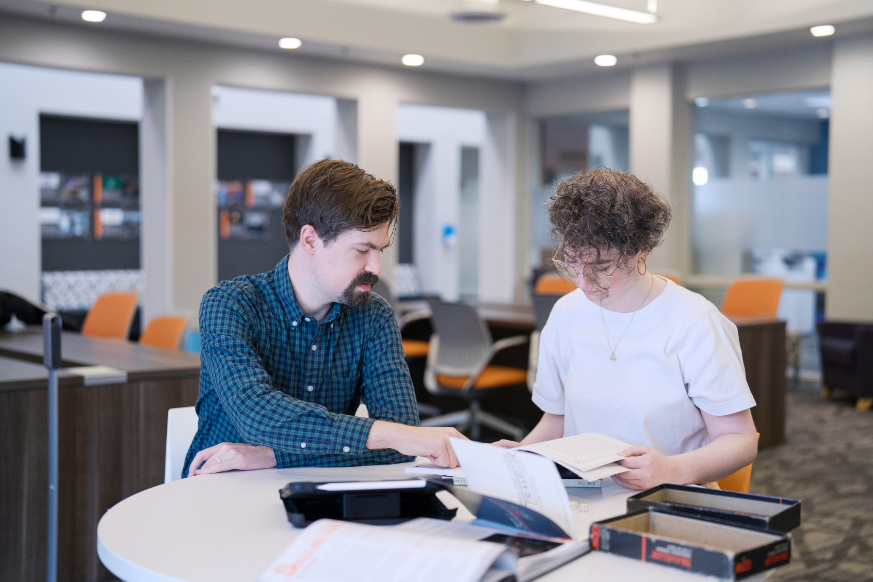 Dr. Cameron Kunzelman works with a Mercer University student in the Communication Theory Research Lab.