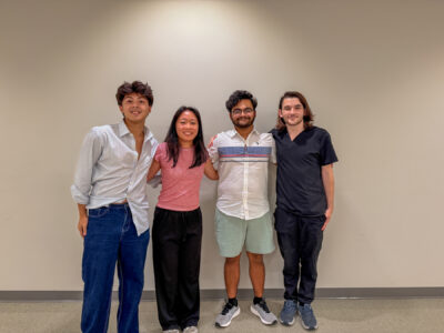 Four mentors pose for a photo.